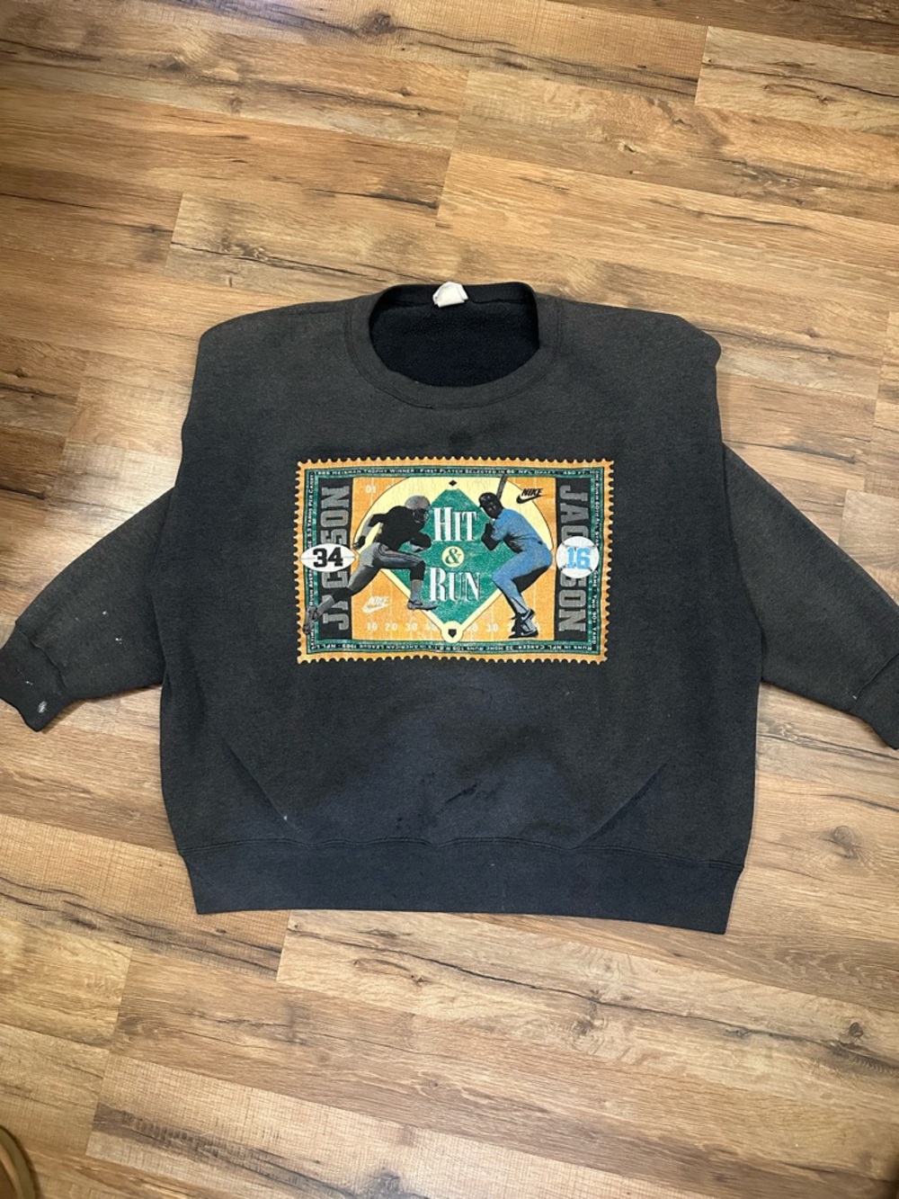 Nike Black Crewneck Sweatshirt with Multicolor 'Hit & Run' Graphic